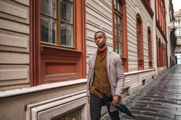 istock Beautiful businessman walking down the street 1324748132