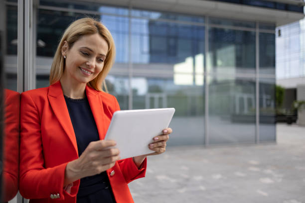 istock Beautiful middle aged Caucasian businesswoman using a digital tablet computer 1324749406