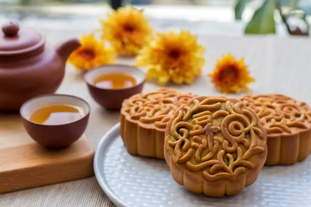 traditional chinese festive season setup for mid autumn. mooncake and tea always a perfect match during gathering
