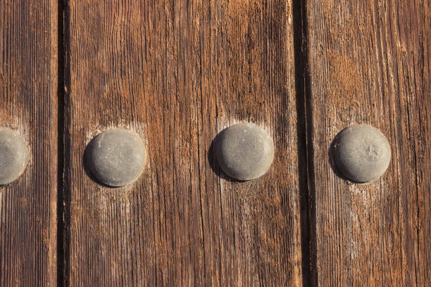 istock Rusty iron ornaments and trim on old wooden doors on the outside 1324749945