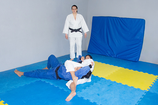 black belt judo fighters training