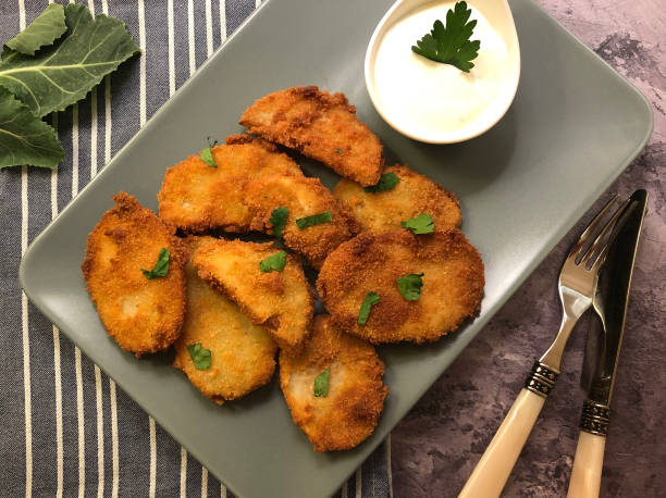 istock Breaded veggie celery steaks with sauce tartare. 1324752441
