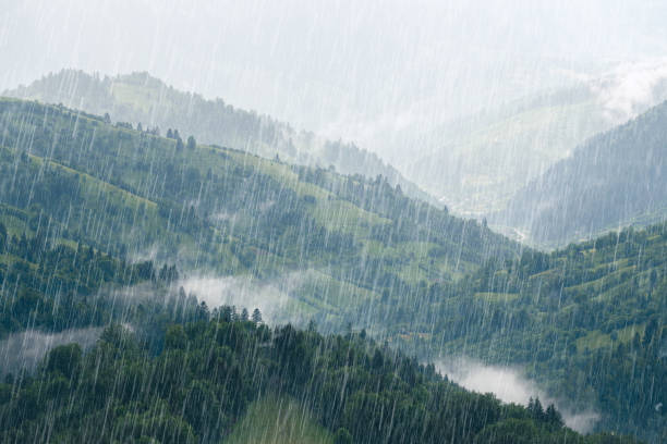 istock Rain over forest mountains. Misty mountain hills landscape on a rainy day. 1324753636