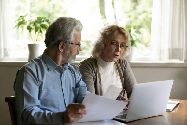 istock Senior couple pay bills on computer online 1324756590