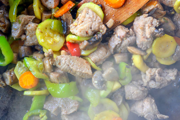istock Preparing Meatballs with vegetables in a Pan 1324757443