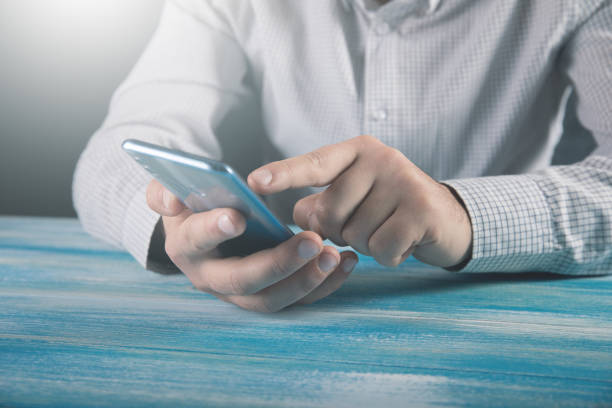 istock office worker clicks on the phone . 1324758929