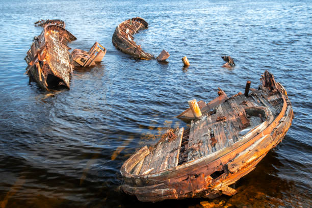 istock Bright rusty old abandoned fishing boat on the coast 1324761461