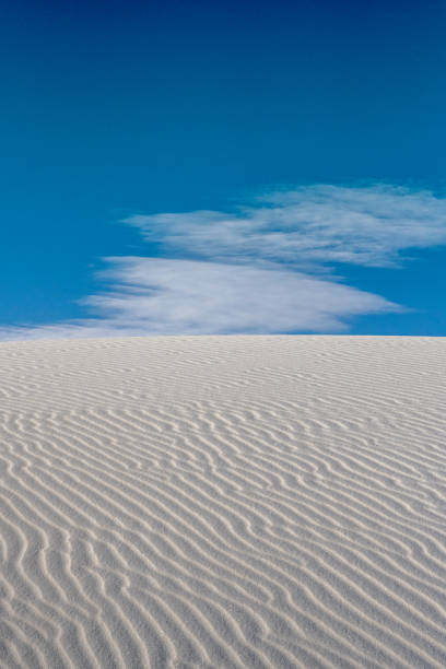 istock Diagonal Ripples Across White Sand Dune 1324762891