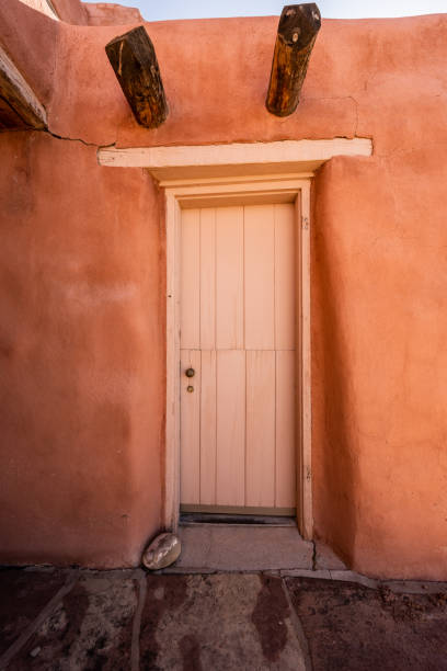 istock Door In Adobe Wall on stucco building 1324763485