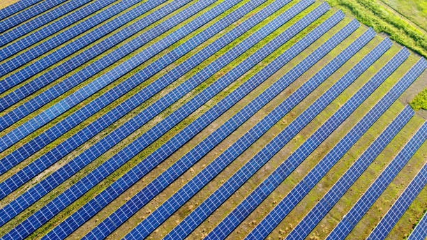 istock Aerial drone view flight over solar power station panels. 1324764193