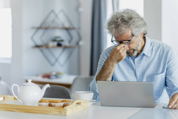 istock Stressful day and working from home for mature man 1324766489