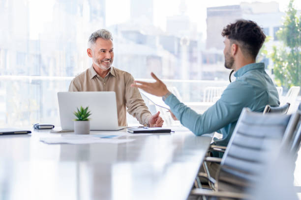 istock Businessmen meeting with digital tablet and laptop computer. 1324767817