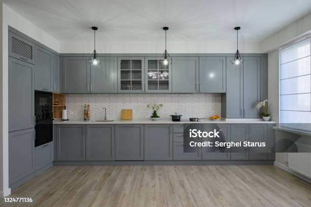 Trendy Grey And White Modern Kitchen Furniture Front View Stock Photo - Download Image Now