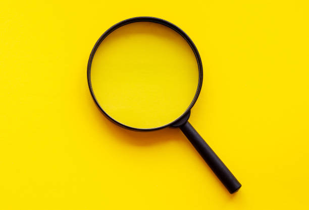 istock magnifying glass magnifier loupe search symbol on yellow background with copy space 1324774624