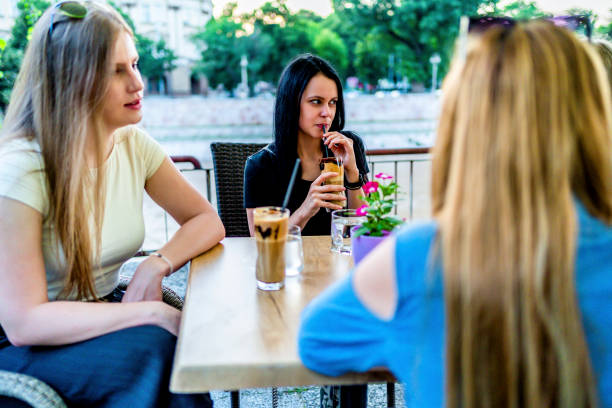 istock Female friends in cafe 1324775049