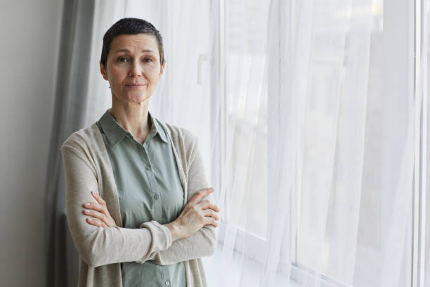 istock Adult Woman by Window 1324780572