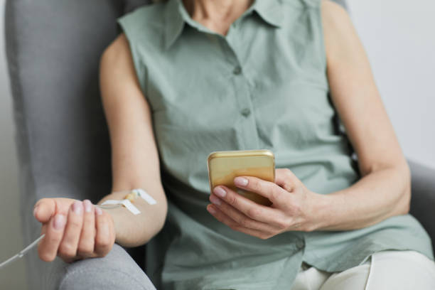 iv drip close up - cancer chemotherapy drug patient women imagens e fotografias de stock