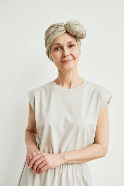 istock Beautiful Mature Woman in White 1324780613