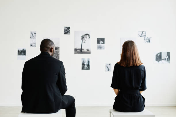 istock Visitors in Art Gallery Back View 1324782169