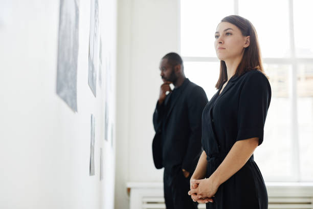 istock People Looking at Photos in Art Gallery 1324782184