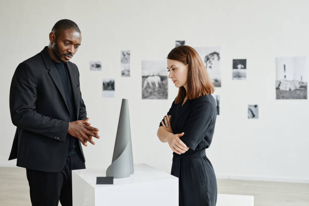 istock Couple Studying Art in Gallery 1324782193