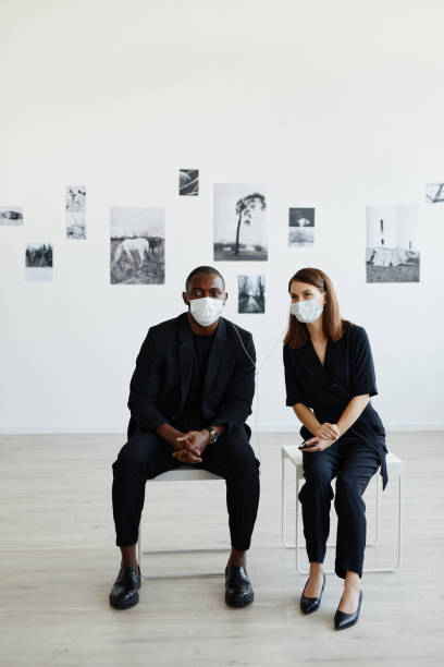 istock Couple Wearing Masks in Gallery 1324782201