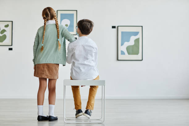 istock Two K ids in Modern Art Gallery 1324782206