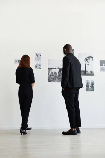 istock People Looking at Art in Gallery 1324782211