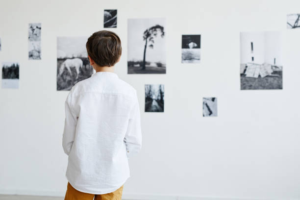 istock Boy Looking at Art in Gallery 1324782214