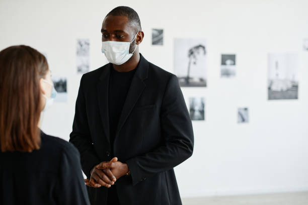 istock People Discussing Art in Gallery 1324782227