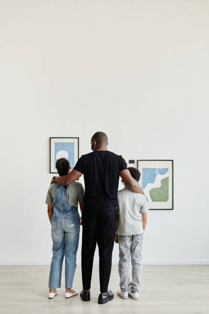 istock Family in Art Gallery Back View 1324782235