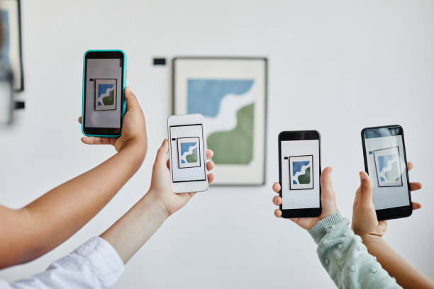istock People Using Smartphones in Art Gallery 1324782256