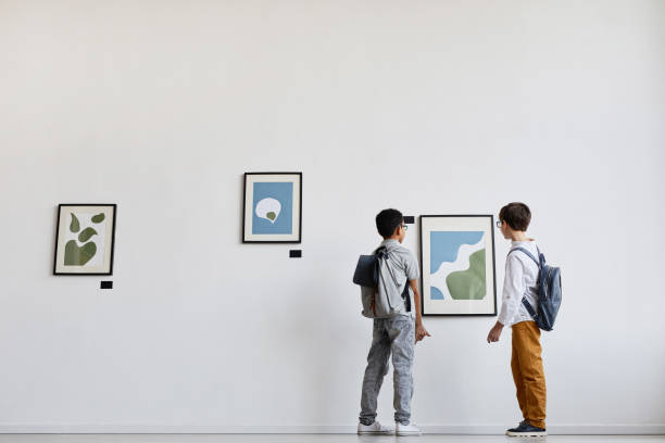 istock Two Boys Looking at Abstract Painting 1324782264