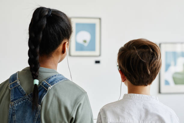 istock Children Using Audio Guide in Art Gallery 1324782279