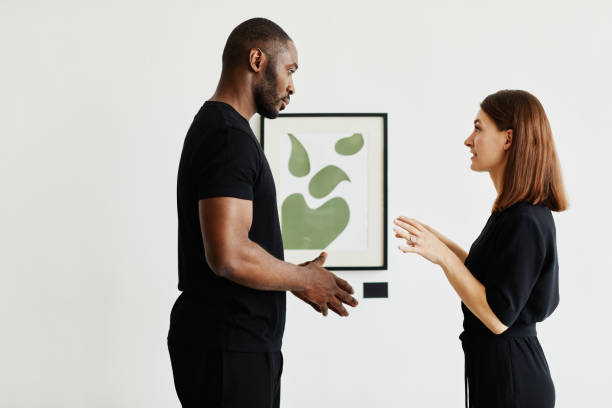 istock Couple Discussing Modern Art 1324782299