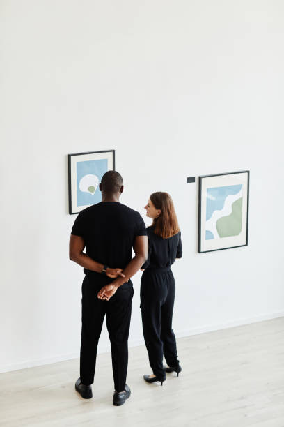 istock Couple Looking at Painting in Gallery 1324782303