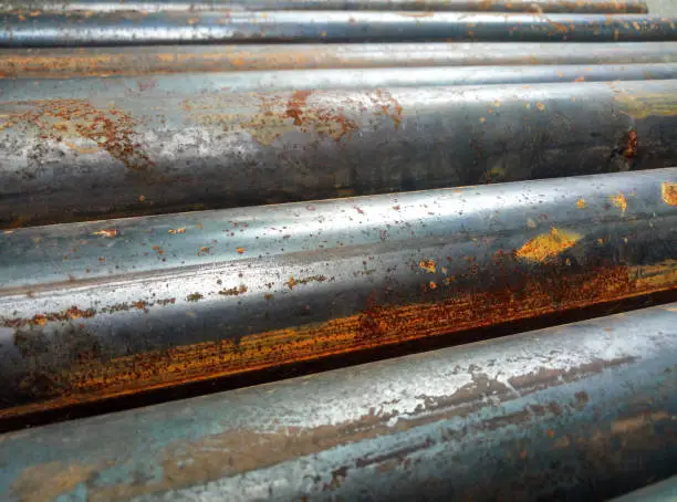 Photo of rusty round iron pipe