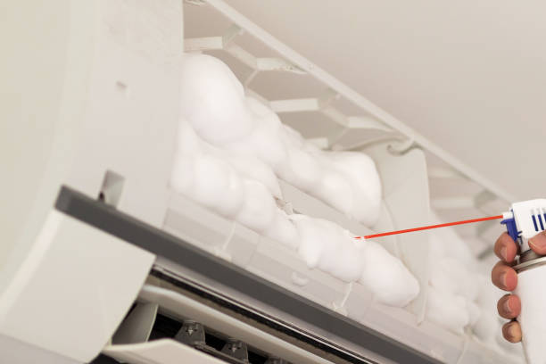 istock air conditioner cleaning with spray foam cleaner 1324788930