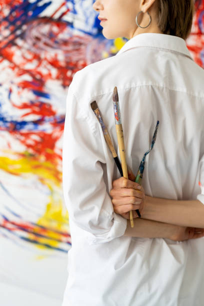 istock painting class modern art artist with paintbrushes 1324789004