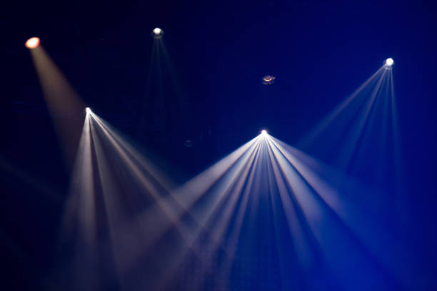 istock Stage lights glowing in the dark 1324789091