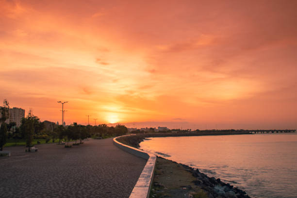 istock orange and blue sunrise on the beach 1324794689