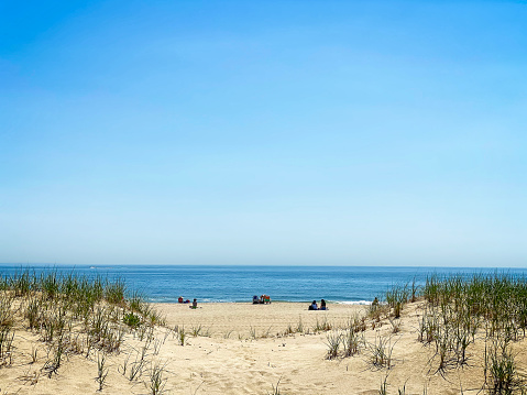 Montauk, NY, USA - May 19 2021: People enjoying summer on a beautiful beach in Montauk