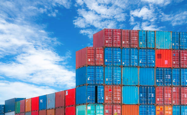 istock Red and blue logistic container against blue sky. Cargo and shipping business. Container ship for import and export logistics. Logistic industry. Container for truck transport and air logistic. 1324797867