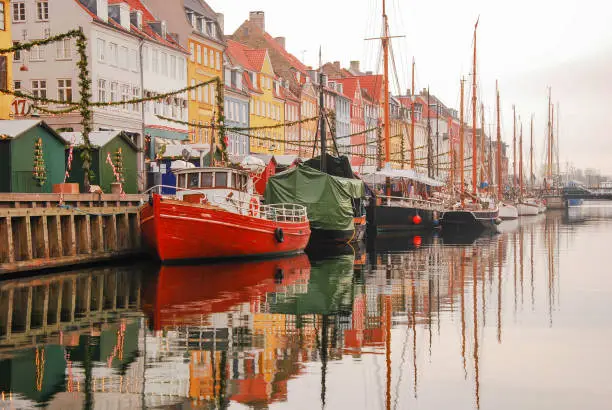 Colourful houses and yachts of Nyhavn pier (New Harbour) in Christmas period, in Copenhagen