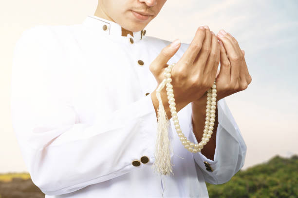 istock Asian Muslim man praying with prayer beads on his hands 1324810177