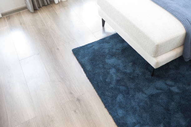 istock dark blue carpet and white sofa in modern living room. 1324814269