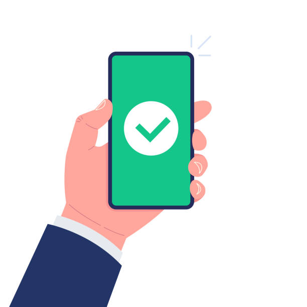 istock Green check mark icon on smartphone screen. Hand holding smartphone with green tick. Vector illustration. 1324818225