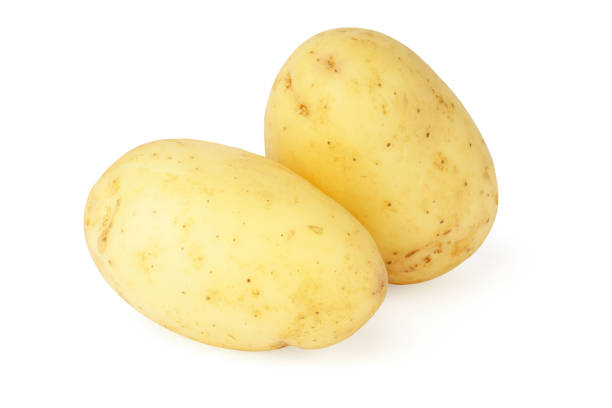 istock young potatoes isolated on white. two whole fresh vegetables. new harvest 1324819463