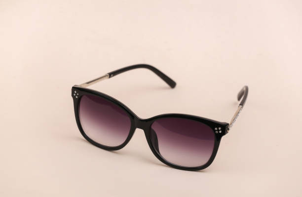 istock Fashionable sunglasses on beige background 1324823461