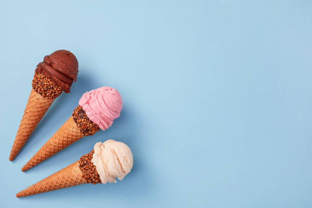 istock Strawberry, vanilla and chocolate ice cream cones 1324824995